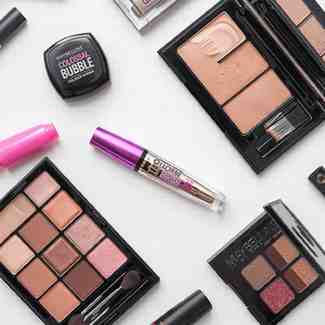 Maybelline Colossal Bubble Mascara flat lay with daily makeup products.